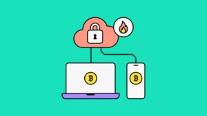 Computer and phone, both showing Bitcoin on their screens, connected to a cloud with a padlock inside, with a flame next to it to symbolize hot wallet